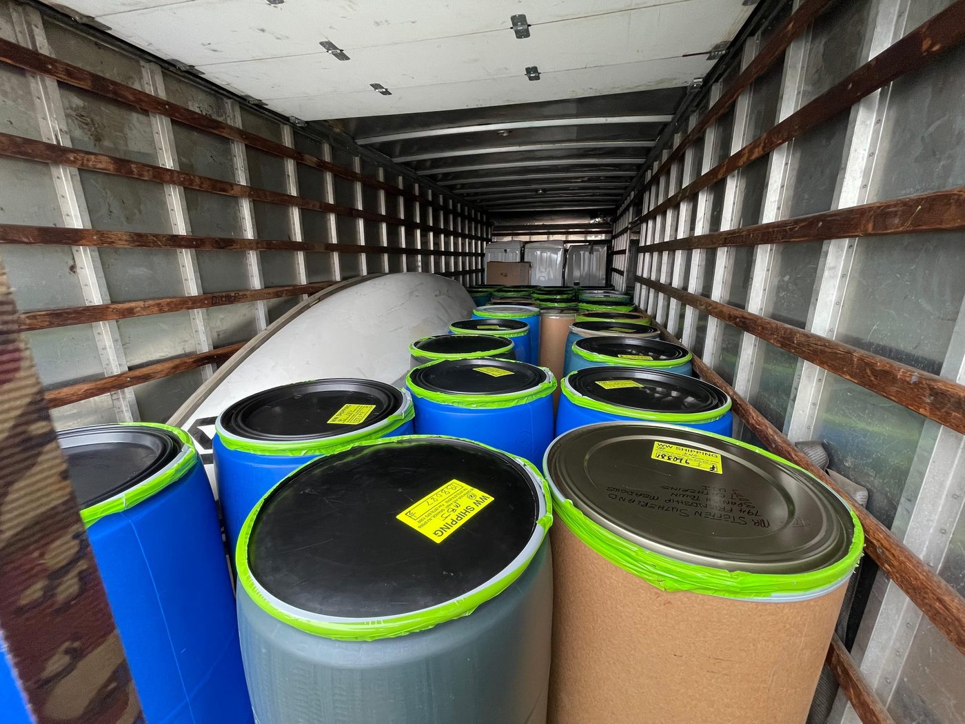 WW Shipping labeled barrels packed inside container