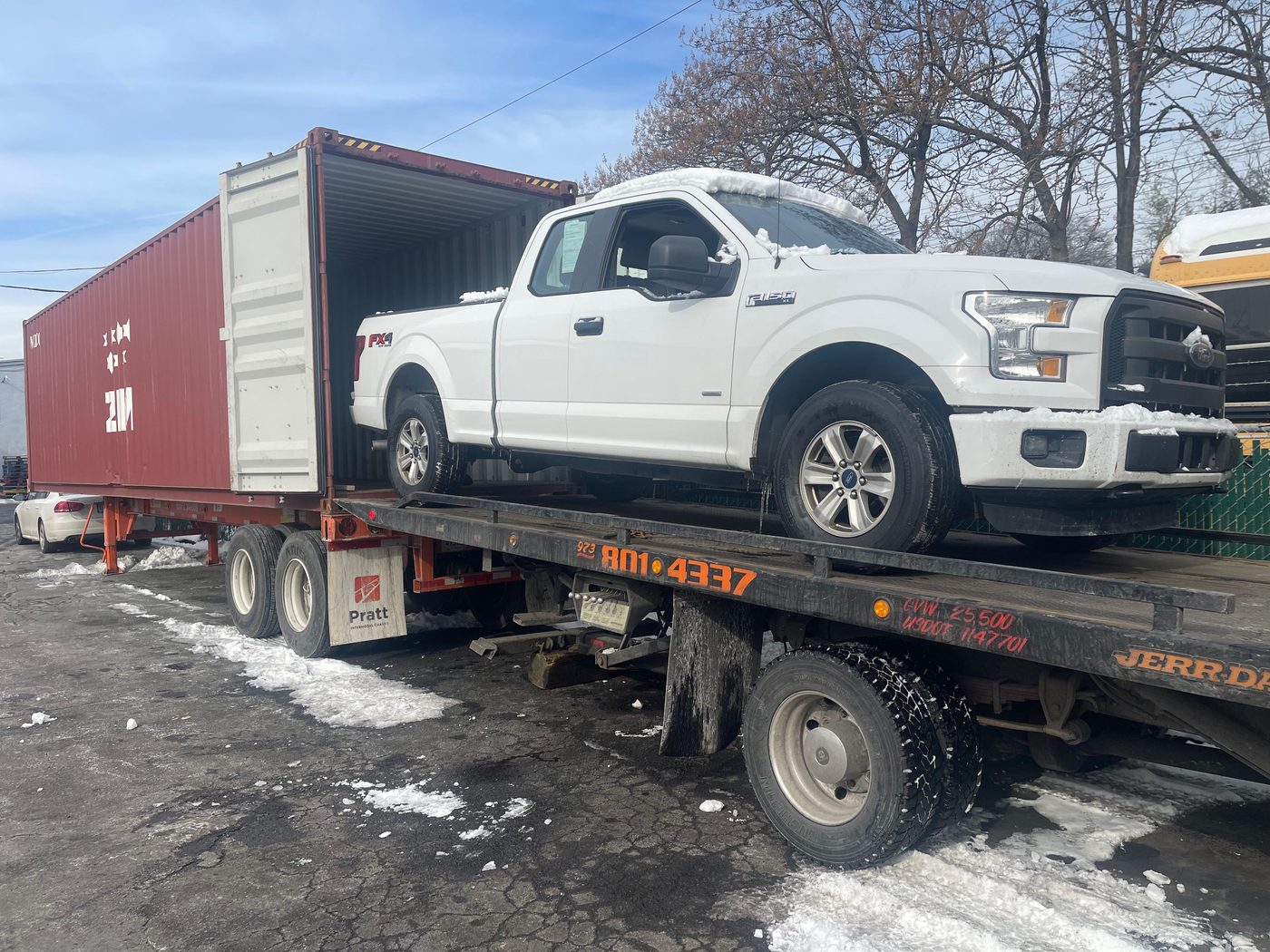 Ford F-150 being loaded into shipping container